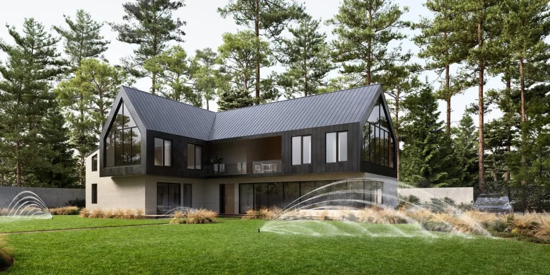 Modern architectural home with a unique design surrounded by lush greenery and landscaped yard.