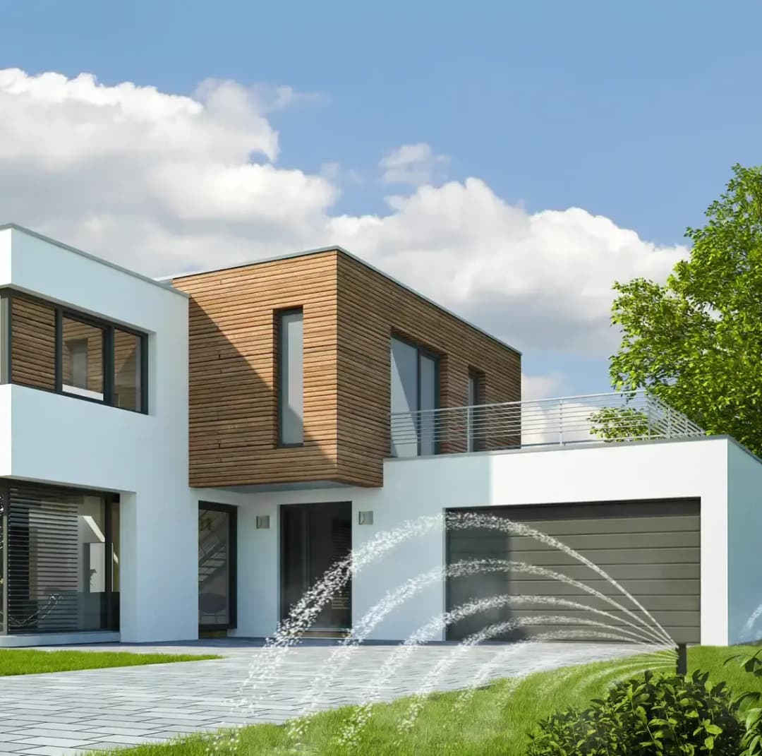 Modern white and wood house with landscaped yard and decorative fountain in front.