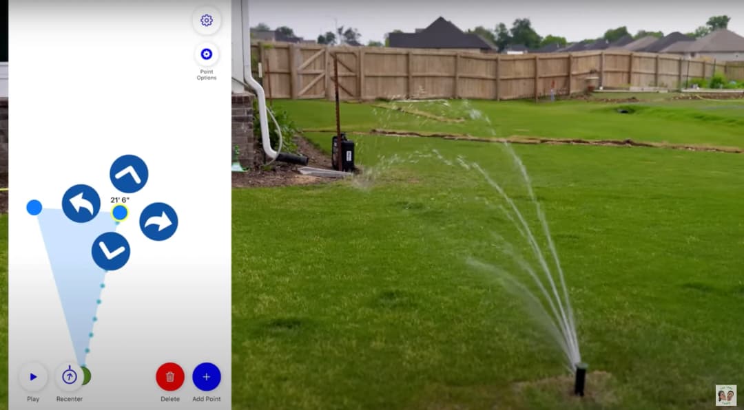 Automated lawn sprinkler system watering a green backyard with control interface visible.