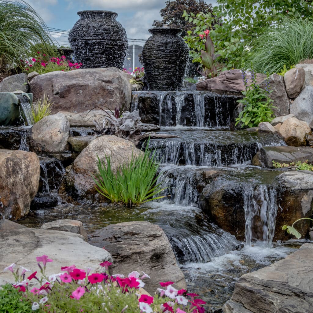 Landscape architecture with waterfall features for summer garden